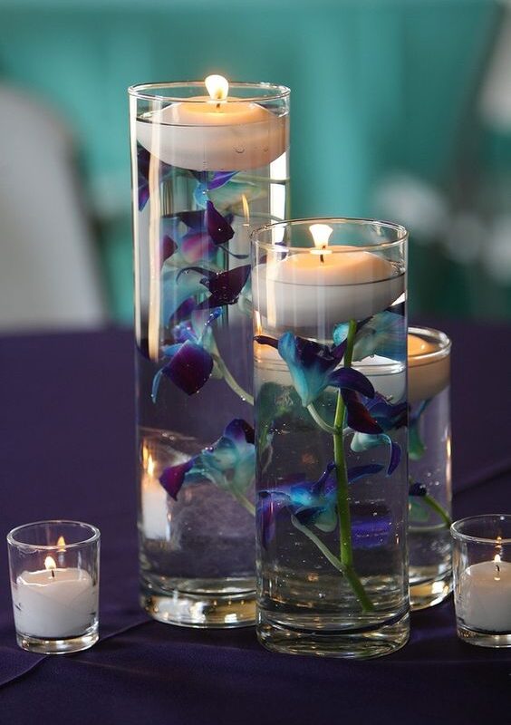 Varied Height Cylinders with Orchids and Floating Candles